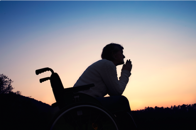 a person in wheelchair in the evening light